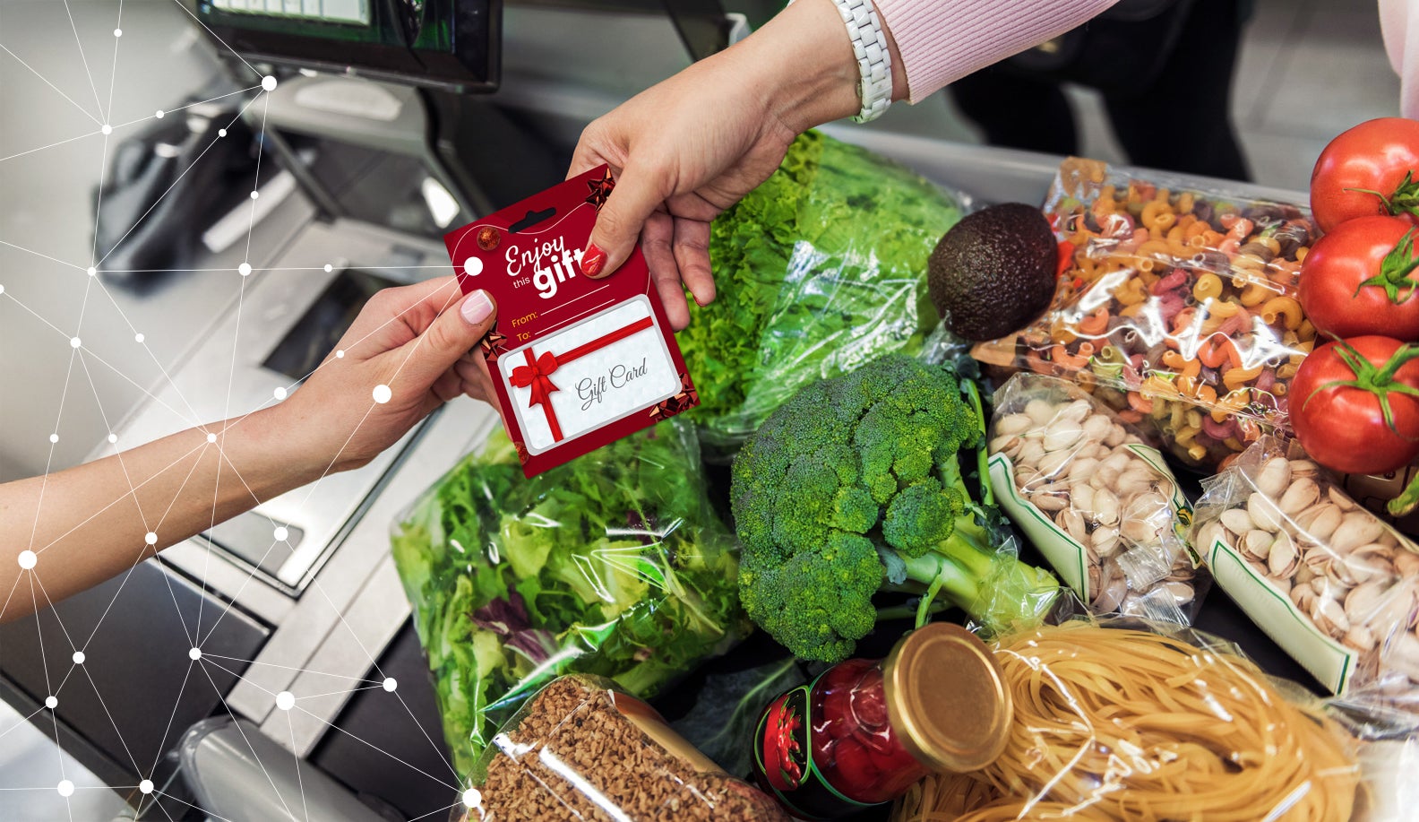 Cashier handing gift card to customer